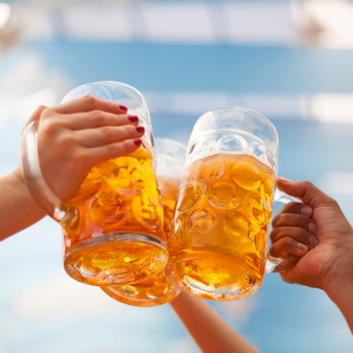 Raised beer mug toasting at Oktoberfest